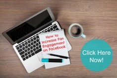 Blank notepad over laptop and coffee cup on office wooden table