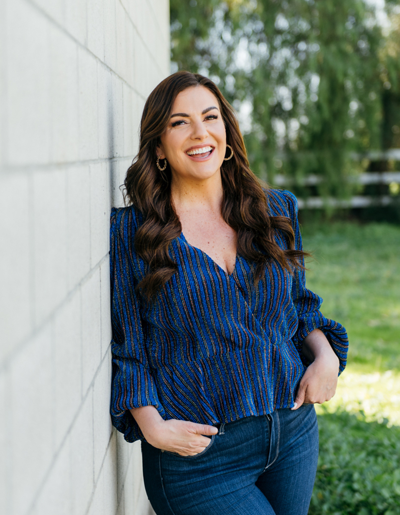 Amy portefield smiling in blue top