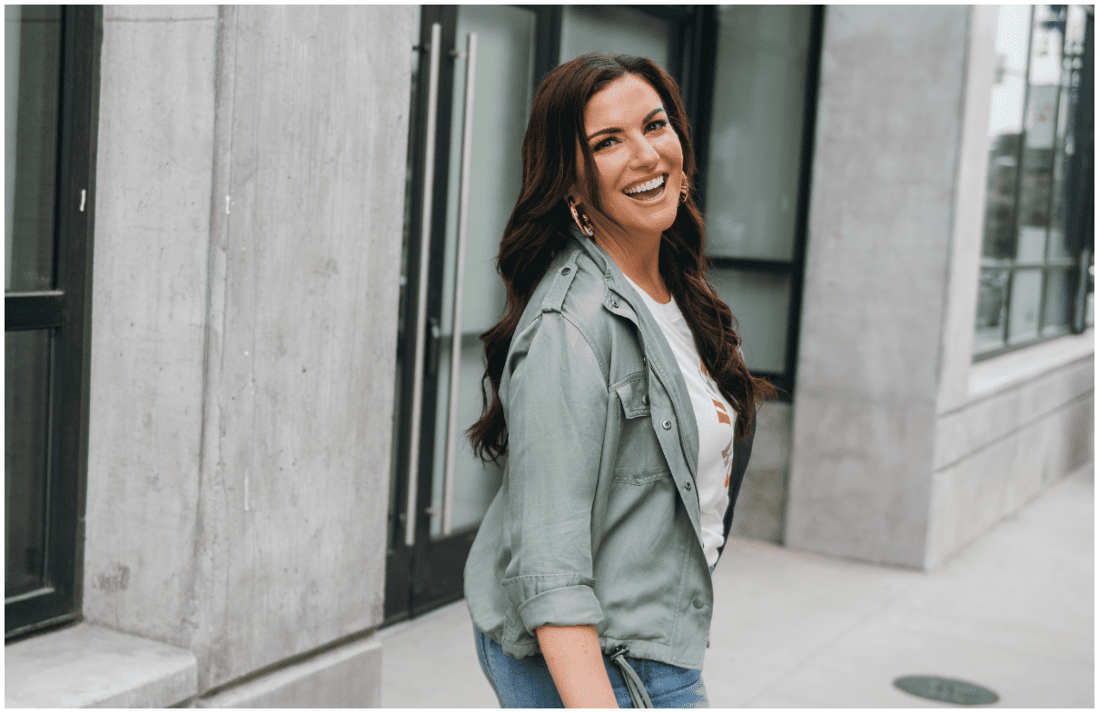 amy porterfield walking on the street looking over her shoulder