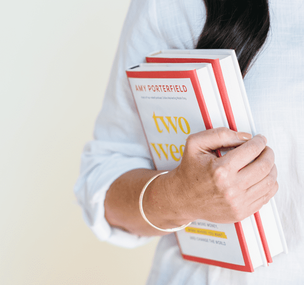 amy porterfield holding book two weeks notice