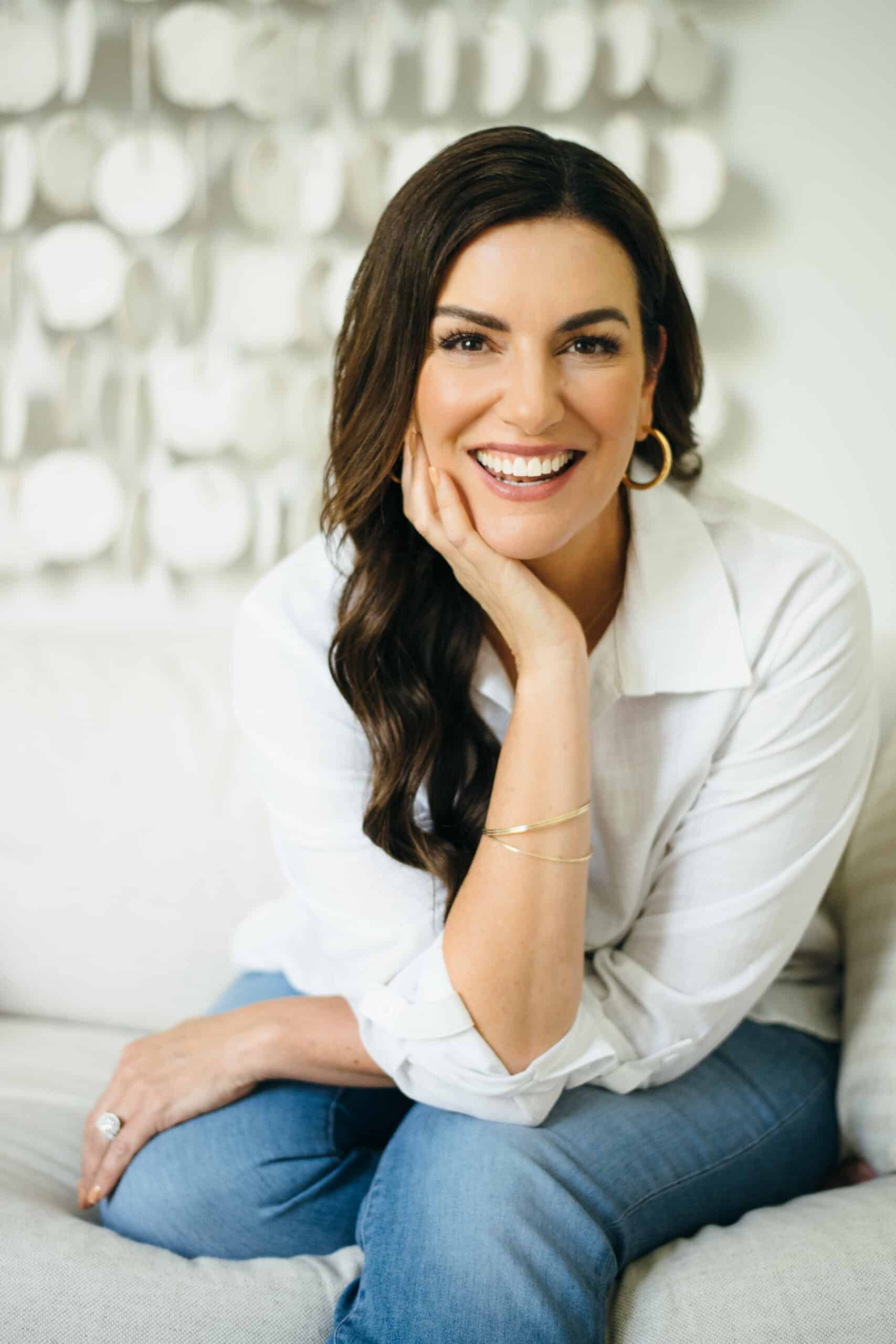 amy porterfield host of online marketing made easy podcast smiling at the camera