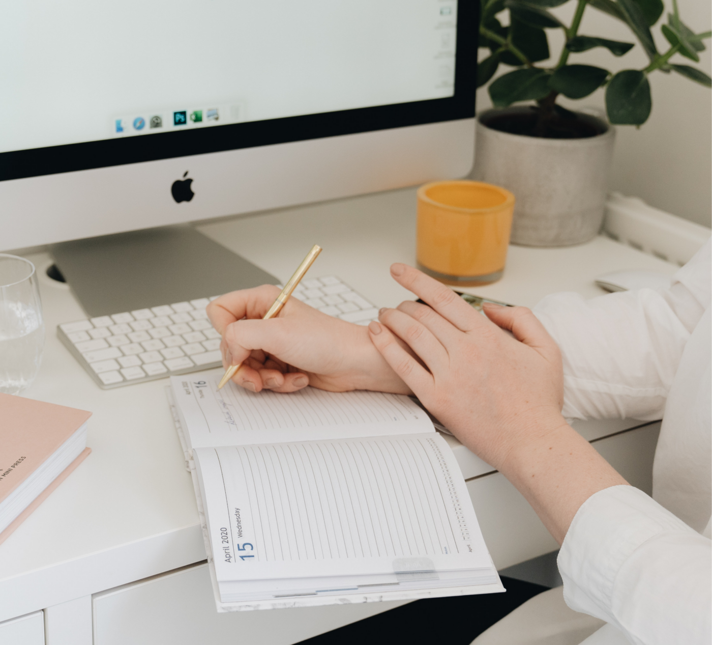 woman using a journal to plan her digital course