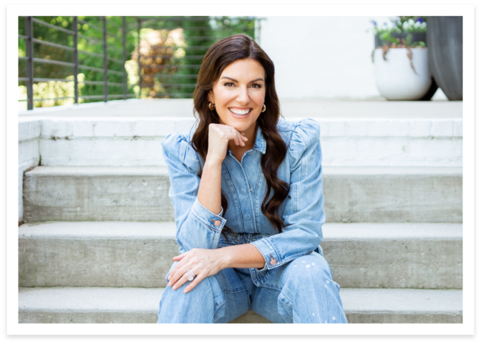 amy porterfield smiling at the camera wearing a blue shirt